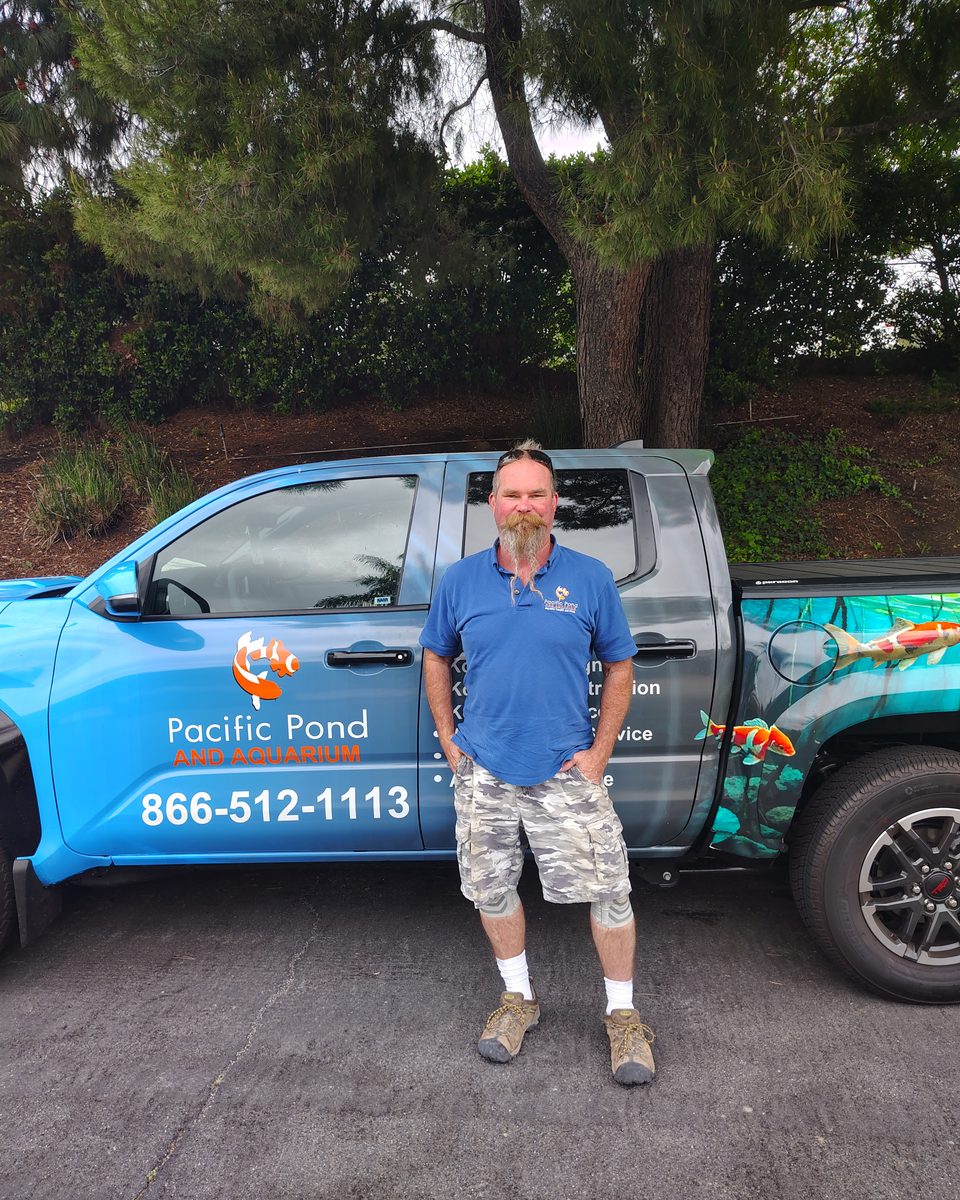 Andrew Cleveland, owner of Pacific Pond and Aquarium, beside the company truck Andrew Cleveland, owner of Pacific Pond and Aquarium, beside the company truck